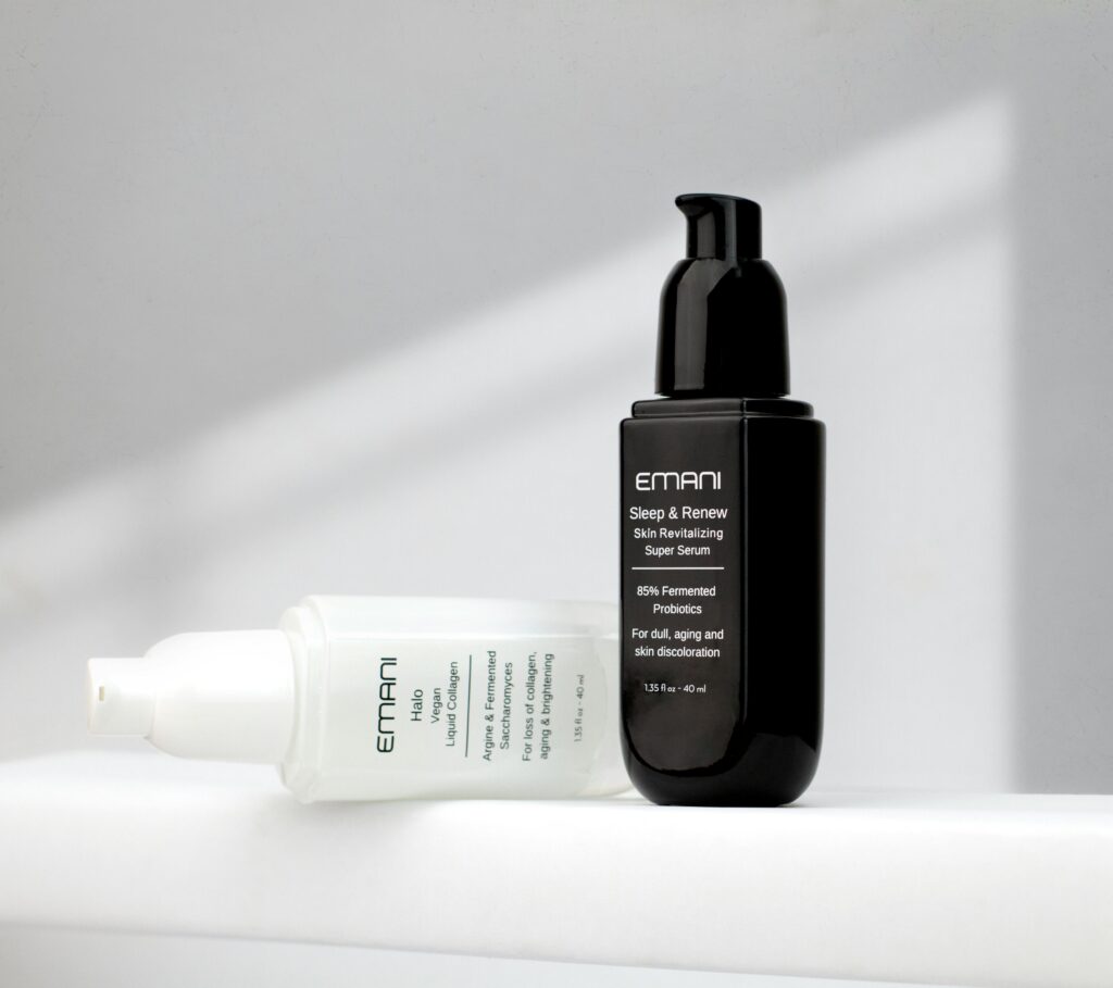 Studio shot of Emani skincare serums on a white background showcasing luxury beauty products.